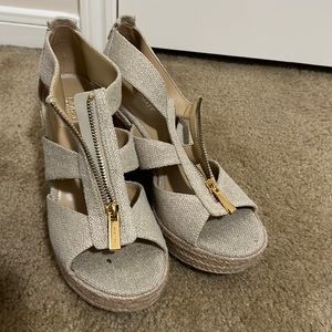 The Michael Kors wedges are a size 7 1/2